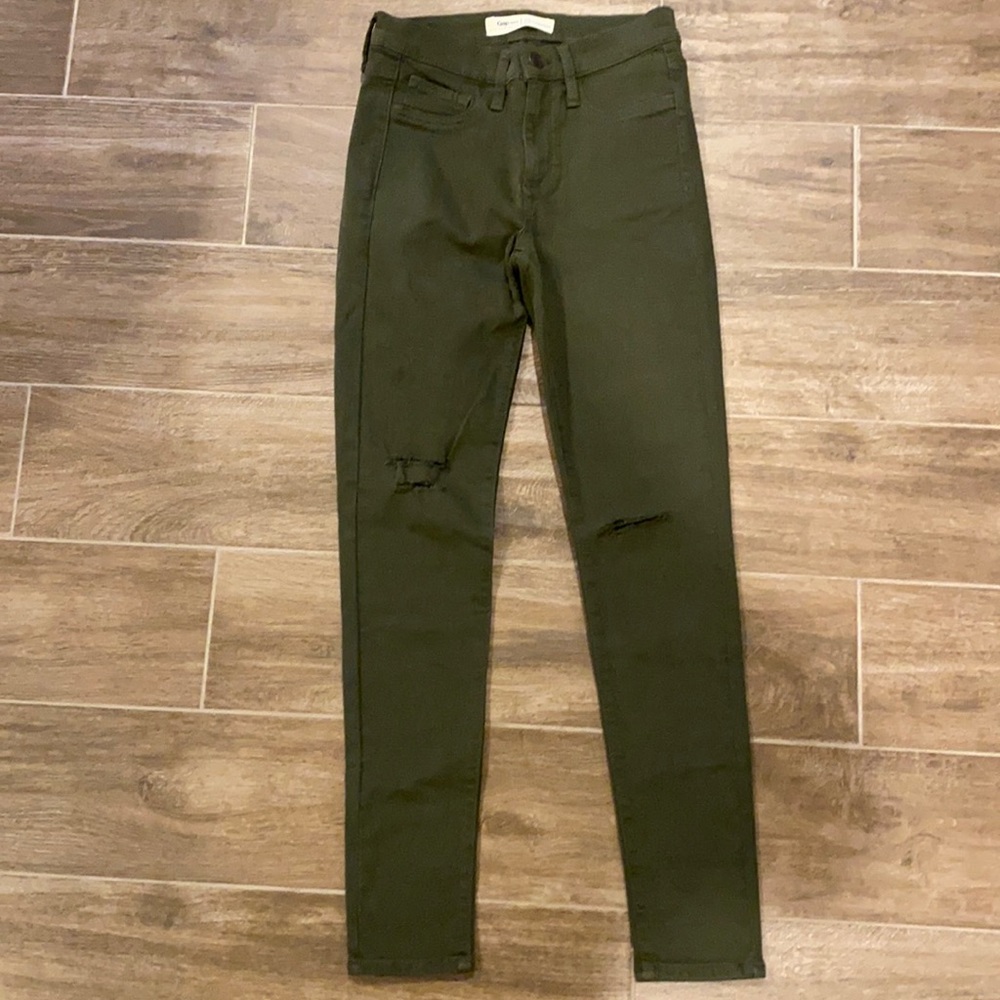 Army green, distressed skinny jeans